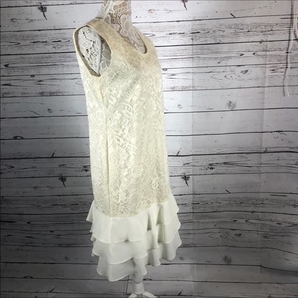 Leslie Fay sleeveless 
Beautiful lace dress with layered ruffles on the end. - Picture 4 of 12